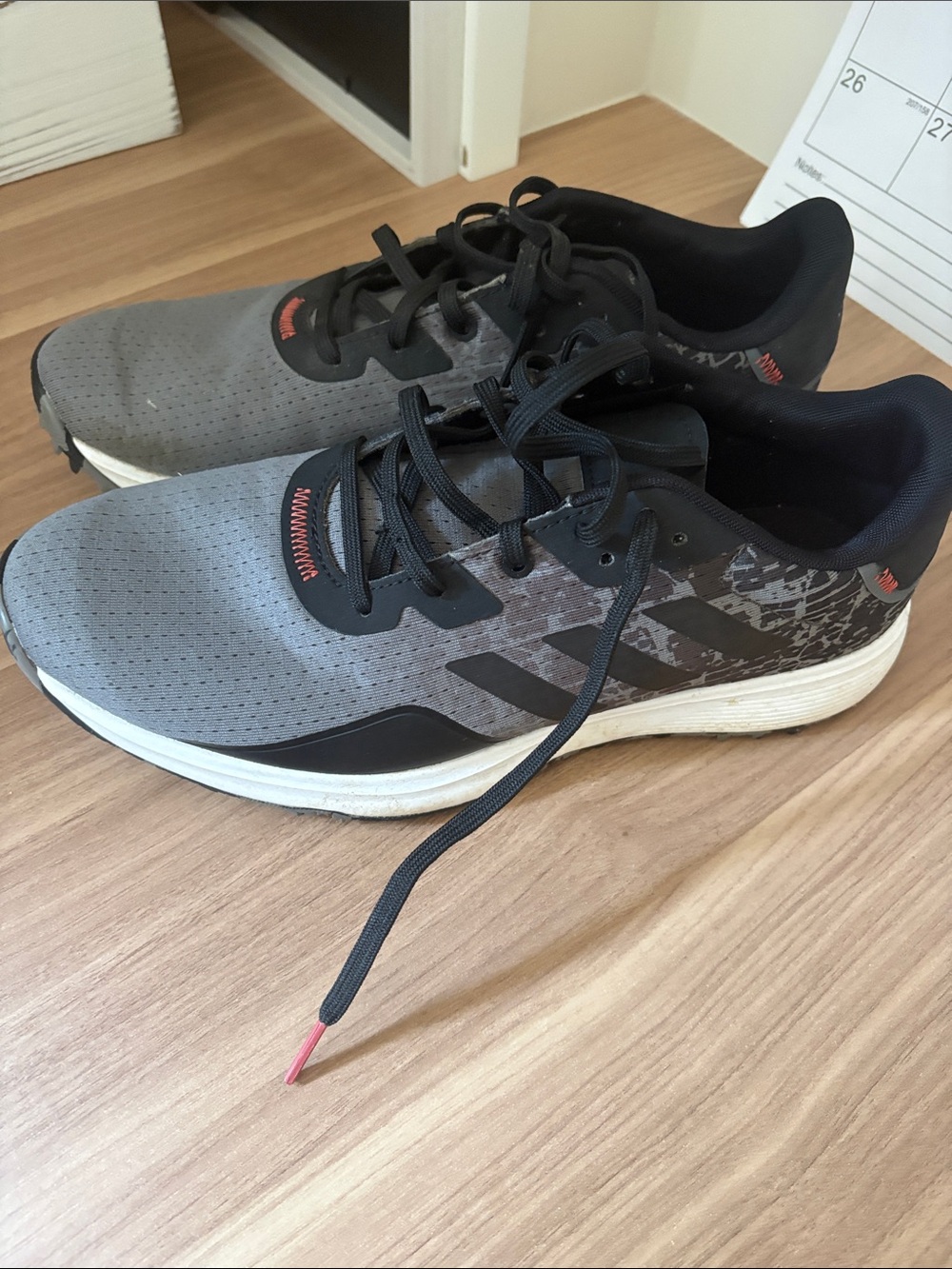 adidas Men’s Gray and Black Athletic golf Shoes with Subtle Orange Accents